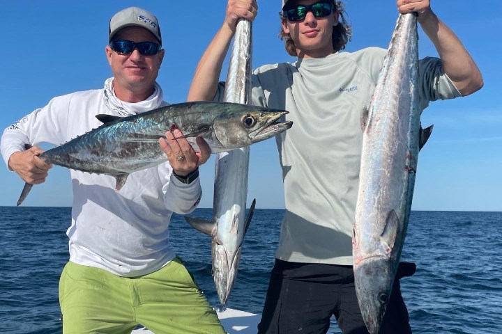 a person holding a fish