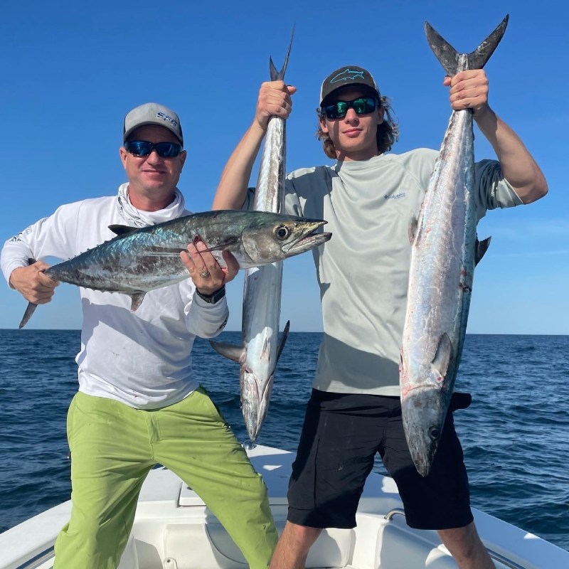 a person holding a fish